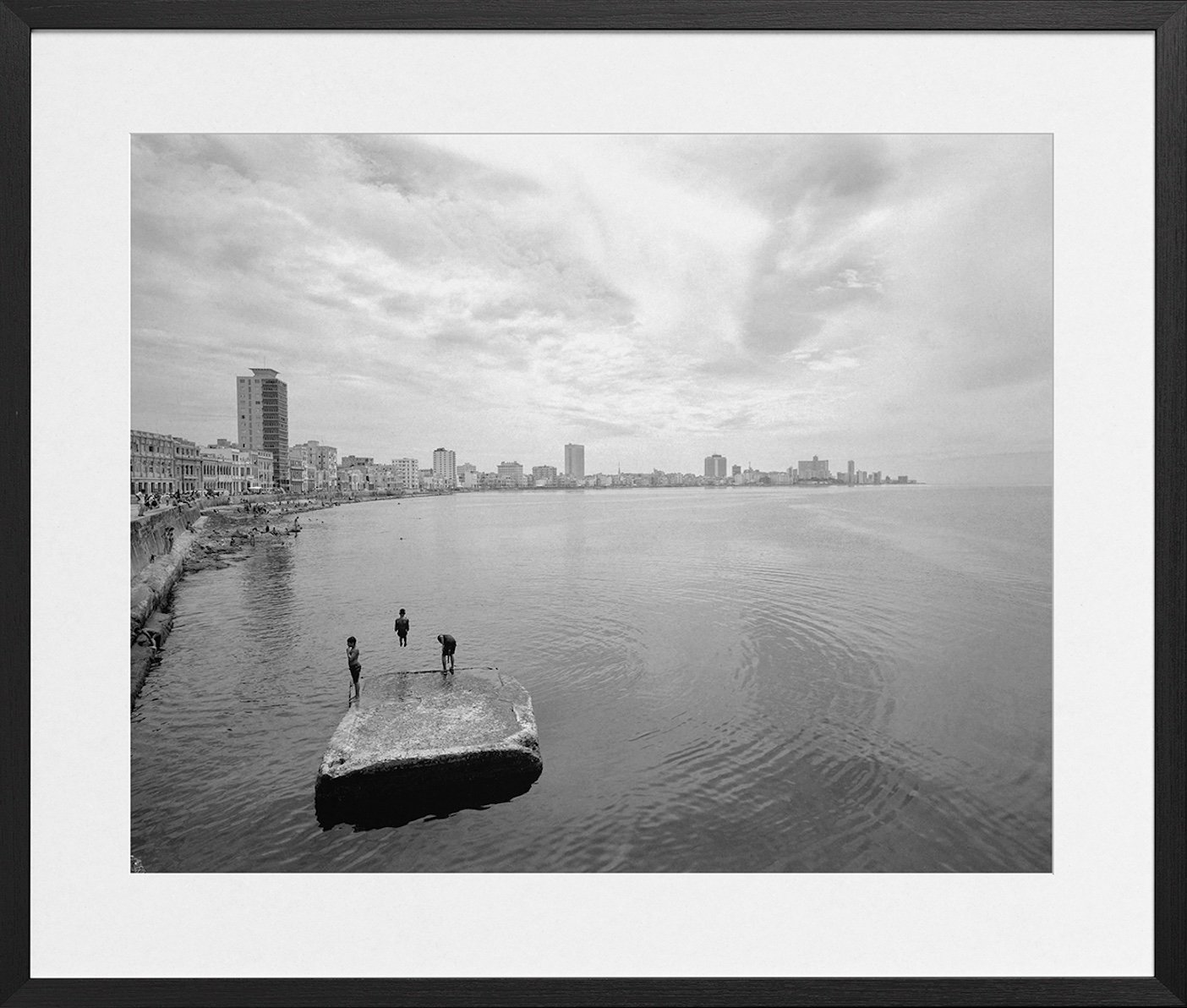 Photo #101. Man Jumping Into Ocean Water. Black and White street scene with a contemplative Cuban man and a Dalmatian 2026